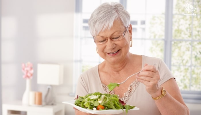 Old woman eating healthy food